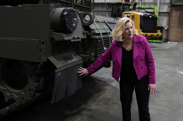 FILE - Secretary of the Army Christine Wormuth looks over the latest version of the M1A2 Abrams main battle tank as she tours the Joint Systems Manufacturing Center, Feb. 16, 2023, in Lima, Ohio. Two U.S. officials say Ukraine has sidelined U.S.-provided Abrams M1A1 battle tanks for now in its fight against Russia. This is in part because Russian drone warfare has made it too difficult for them to operate without detection or coming under attack. (AP Photo/Carlos Osorio, File)