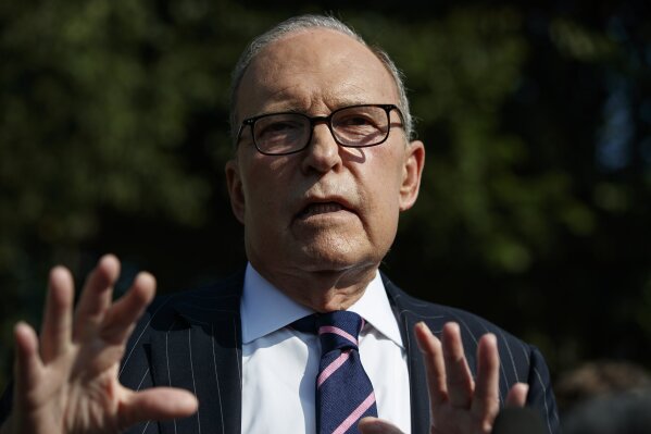 White House chief economic adviser Larry Kudlow talks with reporters outside the White House, Tuesday, Aug. 6, 2019, in Washington. (AP Photo/Evan Vucci)