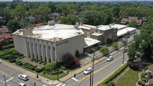 This photo taken with a drone shows the Tree of Life Synagogue, left, in the Squirrel Hill neighborhood of Pittsburgh on Thursday, July 13, 2023, the day a federal jury announced they had found Robert Bowers, who in 2018 killed 11 people at the synagogue, eligible for the death penalty. (AP Photo/Gene J. Puskar)