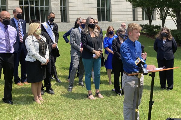 FILE - Dylan Brandt speaks at a news conference outside the federal courthouse in Little Rock, Ark., July 21, 2021. A judge's ruling striking down Arkansas' first-in-the-nation ban on gender-affirming care for minors, on June 20, 2023, is offering hope to transgender people, families and providers after a historic wave of restrictions on trans people's lives sailed through Republican statehouses this year.(AP Photo/Andrew DeMillo, File)