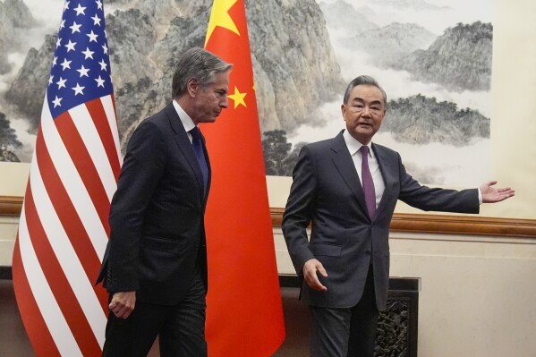 China's Foreign Minister Wang Yi, right, gestures to U.S. Secretary of State Antony Blinken at the Diaoyutai State Guesthouse, Friday, April 26, 2024, in Beijing, China. (AP Photo/Mark Schiefelbein, Pool)