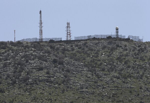 
              In this Tuesday, April 9, 2019 photo, an Israeli military position is seen on an occupied hill of Kfar Chouba village, southeast Lebanon. U.S. President Donald Trump's move to recognize Israel's sovereignty over the occupied Golan Heights has caused concern in Lebanon over its claim to the disputed Chebaa Farms and adjacent Kfar Chouba hills, which Israel occupied alongside the Golan in 1967.(AP Photo/Hussein Malla)
            