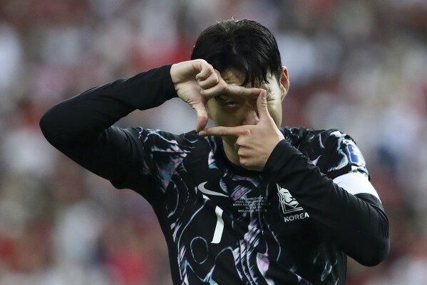 Son Heung Min of South Korea reacts after scoring a goal during 2026 FIFA World Cup Asian 2nd Qualifier soccer match between Singapore and South Korea at the National Stadium in Singapore, on Thursday June 6, 2024. (AP Photo/Suhaimi Abdullah)