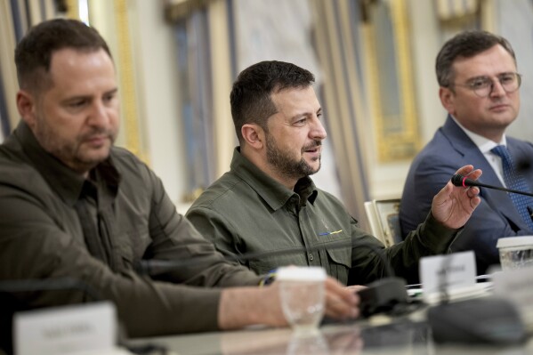 Ukraine's Head of the Office of the President Andriy Yermak, left, and Ukraine's Foreign Minister Dmytro Kuleba, right, listen as Ukraine's President Volodymyr Zelenskyy meets with U.S. Secretary of State Antony Blinken in Kyiv, Ukraine, Wednesday, Sept. 6, 2023. (Brendan Smialowski/Pool via AP)