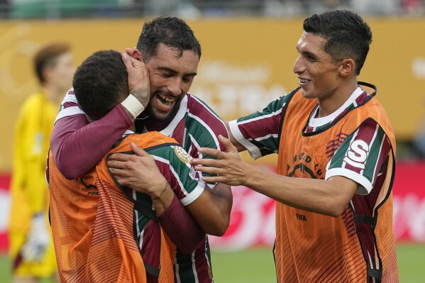 Fluminense's Juan Pablo Freytes, center, celebrates with teammates after scoring a goal against Ulsan HD during the second half of a Club World Cup group F soccer match, Saturday, June 21, 2025, in East Rutherford, N.J. (AP Photo/Seth Wenig)