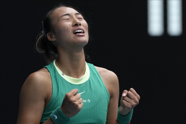 Zheng Qinwen of China celebrates after defeating compatriot Wang Yafan during their third round match at the Australian Open tennis championships at Melbourne Park, Melbourne, Australia, Saturday, Jan. 20, 2024. (AP Photo/Andy Wong)