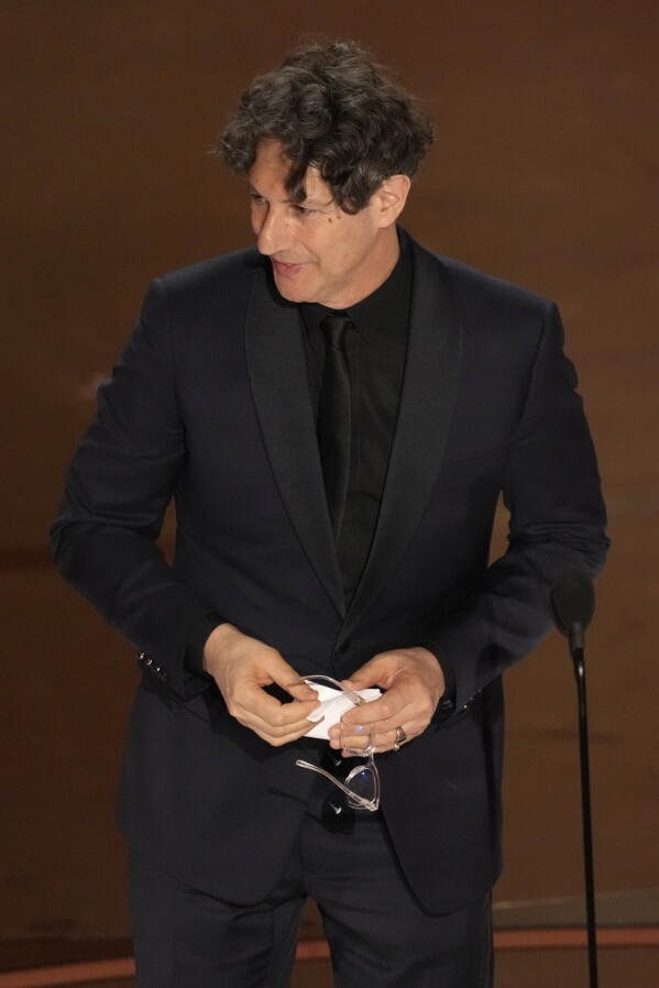 Jonathan Glazer accepts the award for "The Zone of Interest" from the United Kingdom, for best international feature film during the Oscars on Sunday, March 10, 2024, at the Dolby Theatre in Los Angeles. (AP Photo/Chris Pizzello)