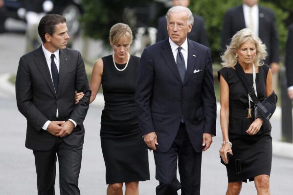 FILE - Hunter Biden walks with his then-wife Kathleen, along with Vice President Joe Biden and Jill Biden for the internment services for Sen. Edward Kennedy at Arlington National Cemetery in Arlington, Va, on Aug. 29, 2009. Kathleen Buhle, the ex-wife of President Joe Biden's son Hunter, says she has "total control over my life now," five years after her divorce, as she opens up about her marriage in a new memoir. (Jim Bourg/Pool via AP)