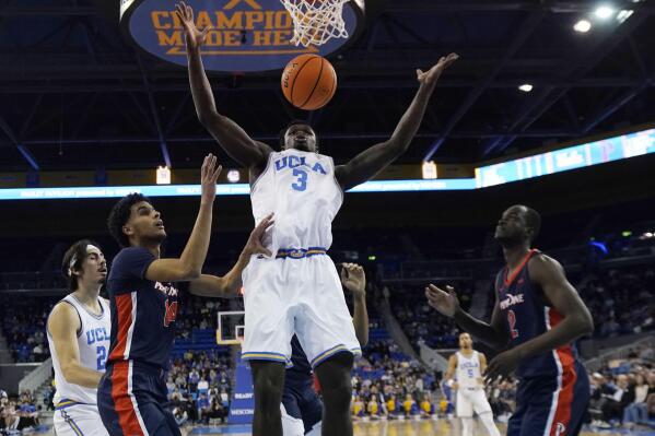 UCLA forward Adem Bona (3) grabs a rebound against Pepperdine during the first half of an NCAA college basketball game Wednesday, Nov. 23, 2022, in Los Angeles. (AP Photo/Marcio Jose Sanchez)