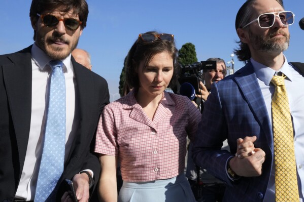 FILE - Amanda Knox arrives at the Florence courtroom in Florence, Italy, Wednesday, June 5, 2024. Knox told Italian TV on Thursday that she was surprised by a Florence appeals court's decision to find her guilty of slander in light of a European court ruling that police who took her confession had violated her human rights. “I will fight for the truth,’’ Knox told Sky TG24 in her first public comments since the guilty verdict on Wednesday. (AP Photo/Antonio Calanni, File)