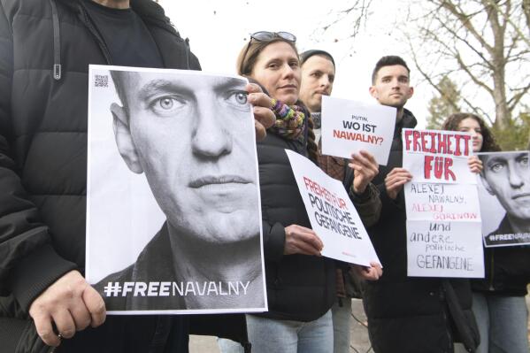 FILE - Demonstrators gather outside the home of Russian ambassador Sergei Netshaev in Berlin, Saturday Dec. 16, 2023, demanding the freedom for all political prisoners in Russia, including Alexei Navalny. Allies of the imprisoned Russian opposition leader Alexei Navalny say they are searching for him for a 13th day after he failed to appear in court. Navalny’s spokesperson wrote on social media that that Navalny had multiple hearings scheduled Monday, Dec. 18, 2023. (Paul Zinken/dpa via AP, File)