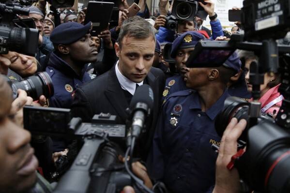 FILE - Oscar Pistorius leaves the High Court in Pretoria, South Africa, on June 14, 2016 during his trail for the murder of girlfriend Reeva Steenkamp. Oscar Pistorius is due on Friday, Jan. 5, 2024 to be released from prison on parole to live under strict conditions at a family home after serving nearly nine years of his murder sentence for the shooting death of girlfriend Reeva Steenkamp on Valentine’s Day 2013. 