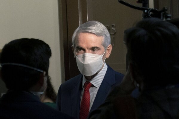 FILE - In this Jan. 19, 2021 file photo, Sen. Rob Portman, R-Ohio, speaks to members of the media outside a Senate Finance Committee hearing on Capitol Hill in Washington. Portman said Monday, Jan. 25 that he won't seek reelection and plans to end a career in federal government spanning more than three decades. (AP Photo/Andrew Harnik, File)