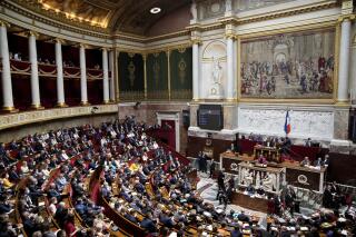 The National Assembly is pictured as French Prime Minister Elisabeth Borne delivers a speech in Paris, France, Wednesday, July 6, 2022. Borne lay out her main priorities at parliament after the government lost its straight majority in the National Assembly in elections last month. (AP Photo/Christophe Ena)