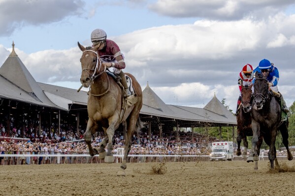 FILE - Epicenter, left, with jockey Joel Rosario, wins the Jim Dandy Stakes horse race at Saratoga Race Course, July 30, 2022, in Saratoga Springs, N.Y. The Horseracing Integrity and Safety Authority in a report released Monday, Feb. 26, 2024, said a multitude of risk factors played into the 13 racing or training deaths of Thoroughbreds during the 2023 season at the track in upstate New York. Another horse died in a barn stall accident. (Skip Dickstein/The Albany Times Union via AP, File)