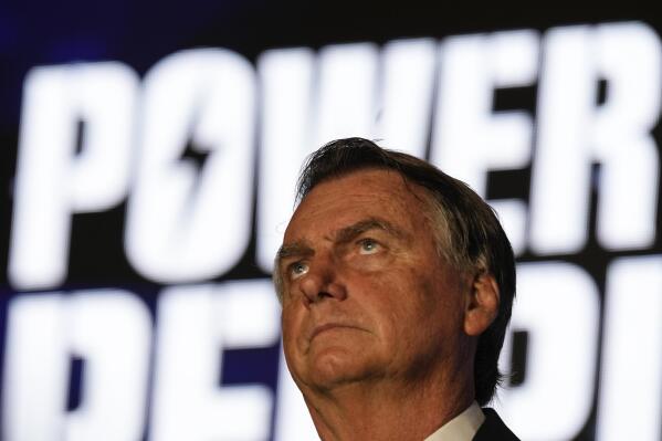 Brazil's right wing former President Jair Bolsonaro speaks at an event hosted by conservative group Turning Point USA, at Trump National Doral Miami, Friday, Feb. 3, 2023, in Doral, Fla. (AP Photo/Rebecca Blackwell)