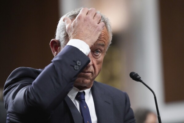 Robert F. Kennedy Jr., President Donald Trump's choice to be Secretary of Health and Human Services, appears before the Senate Finance Committee for his confirmation hearing, at the Capitol in Washington, Wednesday, Jan. 29, 2025. (AP Photo/Ben Curtis)