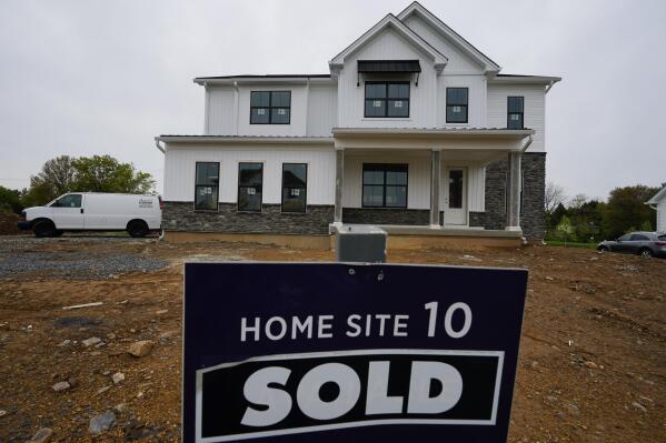 A home under construction at a development in Eagleville, Pa., is shown on Friday, April 28, 2023. Rates on credit cards, mortgages and auto loans, which have been surging since the Fed began raising rates last year, all stand to rise even more. (AP Photo/Matt Rourke)