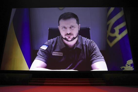 President of Ukraine Volodymyr Zelenskyy appears via remote during the opening ceremony of the 75th international film festival, Cannes, southern France, Tuesday, May 17, 2022. (Photo by Vianney Le Caer/Invision/AP)