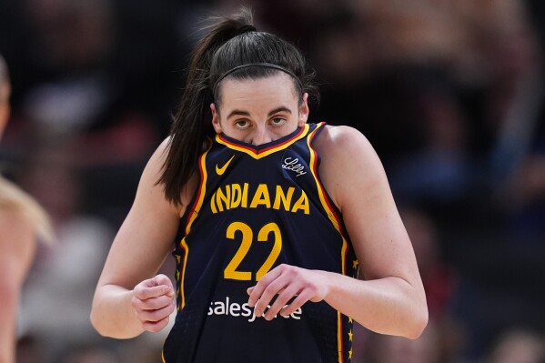 Raucous crowd roars its approval for Caitlin Clark in her home debut with  Fever, an 83-80 win | AP News