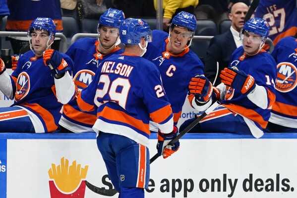 New York Islanders' Brock Nelson (29) is congratulated for his goal against the Philadelphia Flyers during the second period of an NHL hockey game Wednesday, Nov. 22, 2023, in Elmont, N.Y. (AP Photo/Frank Franklin II)