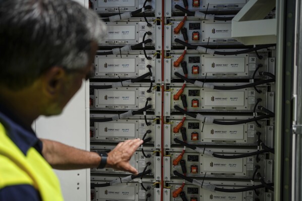 Craig Horne, vice president of advanced energy solutions for Energy Vault, a company that is creating an emergency power system that relies on hydrogen and battery storage, shows a battery system Tuesday, May 27, 2025, in Calistoga, Calif. (AP Photo/Annika Hammerschlag)