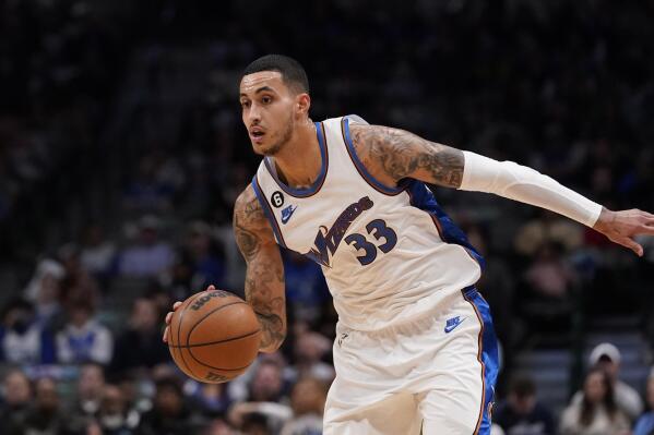 Washington Wizards forward Kyle Kuzma (33) dribbles during the second half of an NBA basketball game against the Dallas Mavericks in Dallas, Tuesday, Jan. 24, 2023. The Wizards won 127-126. (AP Photo/LM Otero)