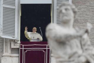 Pope Francis delivers the Angelus noon prayer in St.Peter's Square, at the Vatican, Sunday, Jan. 9, 2022. (AP Photo/Gregorio Borgia)