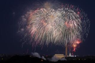 FILE - In this Saturday, July 4, 2020, file photo, Fourth of July fireworks explode over the Lincoln Memorial, the Washington Monument and the U.S. Capitol along the National Mall in Washington. President Joe Biden wants to imbue Independence Day with new meaning in 2021 by encouraging nationwide celebrations to mark the country’s effective return to normalcy after 16 months of pandemic disruption. The White House says the National Mall in Washington will host the traditional fireworks ceremony and it's encouraging other communities hold festivities as well. (AP Photo/Cliff Owen, File)