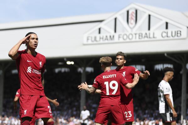 Liverpool's Darwin Nunez, right, celebrates after scoring during the English Premier League soccer match between Fulham and Liverpool at Craven Cottage stadium in London, Saturday, Aug. 6, 2022. (AP Photo/Ian Walton)