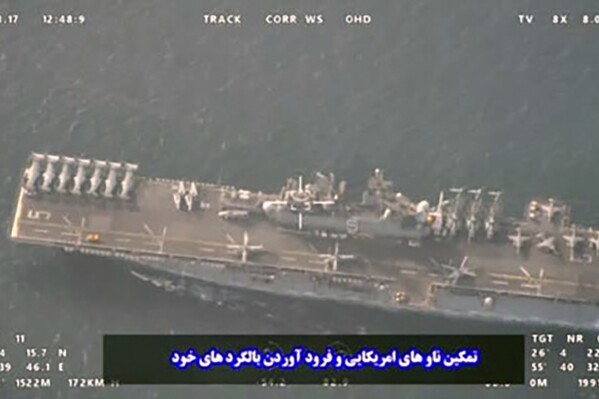 This image provided by the Iranian Revolutionary Guard via Tasnim News Agency on Sunday, Aug. 20, 2023, shows the USS Bataan at the Strait of Hormuz, in the mouth of the Persian Gulf. (Iranian Revolutionary Guard/Tasnim News Agency via AP)