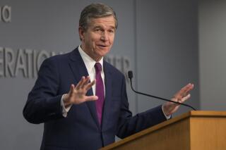 North Carolina Gov. Roy Cooper speaks to reporters during a COVID-19 news conference at the state Emergency Operations Center in Raleigh, N.C. on Wednesday, July 21, 2021. (Julia Wall/The News & Observer via AP)