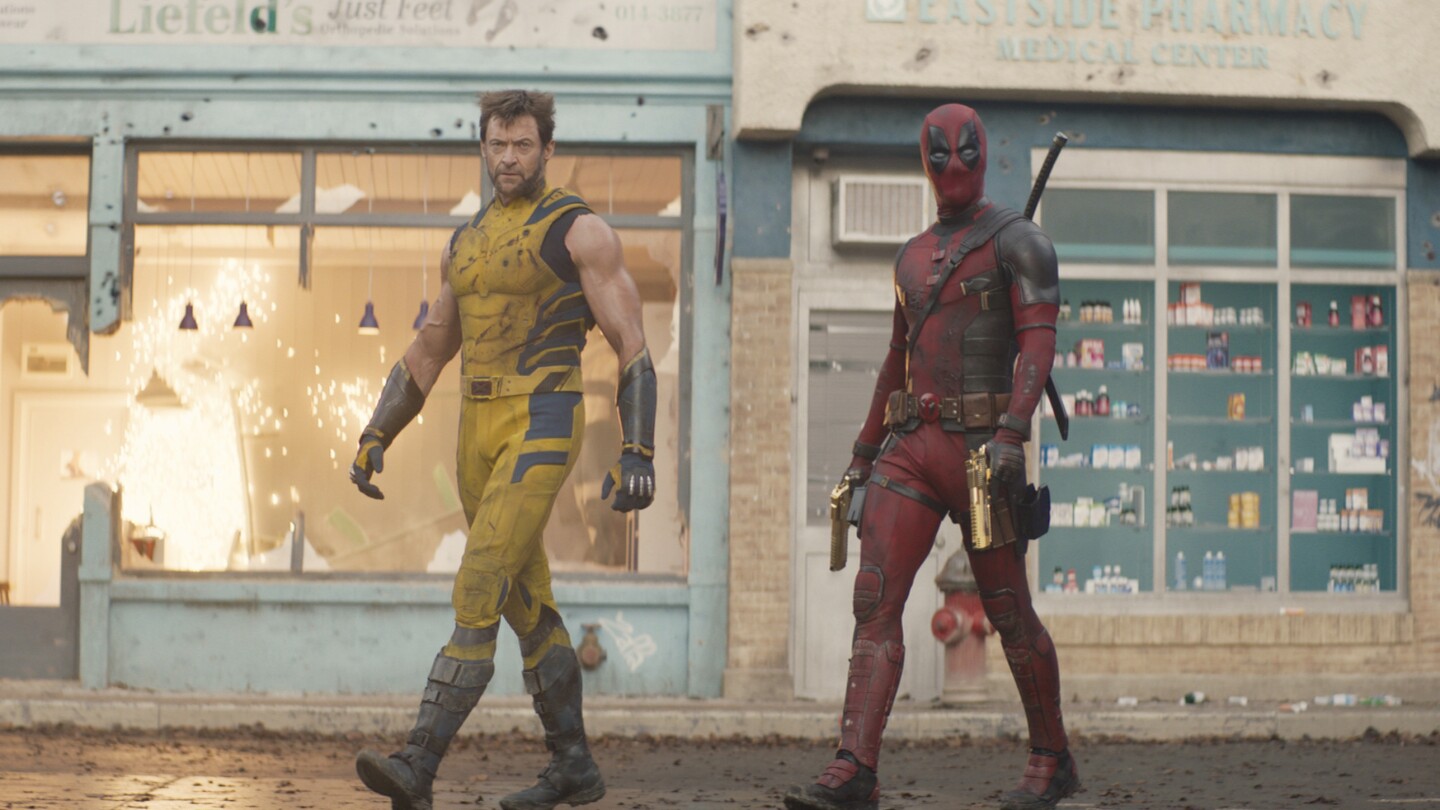 This image released by 20th Century Studios/Marvel Studios shows Hugh Jackman as Wolverine/Logan, left, and Ryan Reynolds as Deadpool/Wade Wilson in a scene from "Deadpool & Wolverine." (20th Century Studios/Marvel Studios via AP)