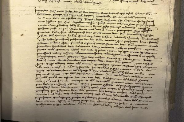 This picture made available on Wednesday, March 15, 2023, by historian Carlo Vecce shows what Vecce says is the original act of liberation of the slave Caterina, who he believes is the mother of Leonardo da Vinci and notarized by Leonardo's father Piero da Vinci. Vecce says he found it in the State Archives in Florence as described in his latest novel 'Caterina's smile'. (Carlo Vecce via AP)
