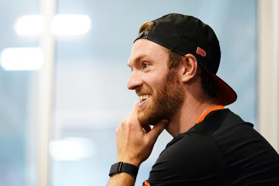 Philadelphia Flyers' Sean Couturier smiles during a news conference at the team's NHL hockey practice facility, Monday, Sept. 12, 2022, in Voorhees, N.J. (AP Photo/Matt Slocum)