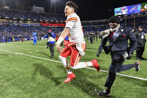 Kansas City Chiefs quarterback Patrick Mahomes (15) reacts after defeating the Buffalo Bills in an NFL AFC division playoff football game, Sunday, Jan. 21, 2024, in Orchard Park, N.Y. (AP Photo/Adrian Kraus)