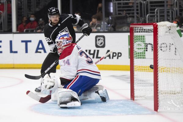 Los Angeles Kings right wing Viktor Arvidsson (33) watches the goal by left wing Arthur Kaliyev (34) go past Montreal Canadiens goaltender Jake Allen (34) during the second period of an NHL hockey game, Saturday, Oct. 30, 2021, in Los Angeles. (AP Photo/Kyusung Gong)