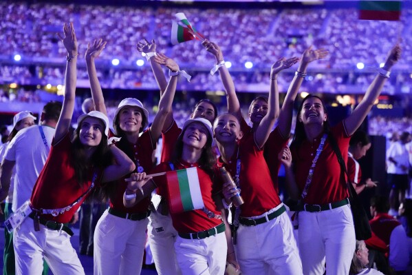Athletes react during the 2024 Summer Olympics closing ceremony at the Stade de France, Sunday, Aug. 11, 2024, in Saint-Denis, France. (AP Photo/Ashley Landis)
