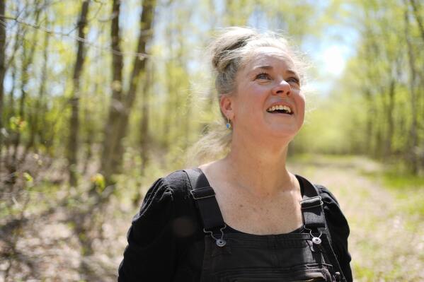 Heather Donahue, the star of the The Blair Witch Project, pauses on a walk to watch a songbird,Tuesday, May 13, 2025, in Freedom, Maine. (AP Photo/Robert F. Bukaty)