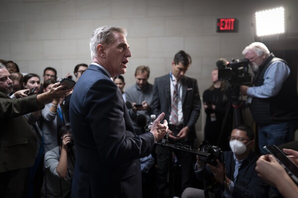 Former Speaker Kevin McCarthy, R-Calif., talks to reporters as House Republicans hold a closed-door forum to hear from the candidates for speaker of the House, at the Capitol in Washington, Tuesday, Oct. 10, 2023. New polling shows that the unprecedented ouster of House Speaker Kevin McCarthy has left no consensus among Republicans about whether his removal was the right move. (AP Photo/J. Scott Applewhite)