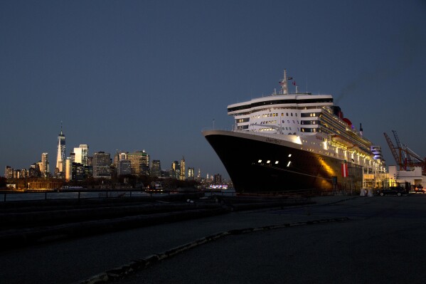 The Queen Mary 2 prepares to depart the Red Hook Terminal, bound for Southampton, England, in the Brooklyn borough of New York, Nov. 11, 2018. (AP Photo/Mark Lennihan, File)