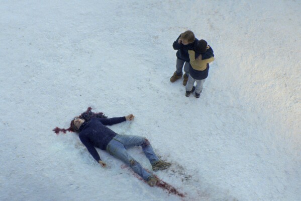 This image released by Neon shows, from left, Samuel Theis, Sandra Hüller and Milo Machado Graner in a scene from "Anatomy of a Fall." (Neon via AP)