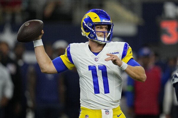 Los Angeles Rams quarterback Brett Rypien (11) throws during the second half of an NFL football game against the Dallas Cowboys Sunday, Oct. 29, 2023, in Arlington, Texas. (AP Photo/Julio Cortez)