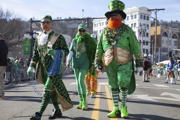 Attendees gather at the 22nd Annual World's Shortest St. Patrick's Day Parade on Monday, March 17, 2025, in Hot Springs, Ark. (AP Photo/Katie Adkins)