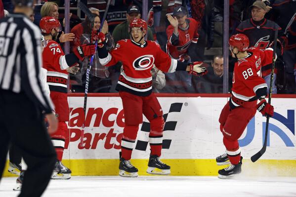 Seth Jarvis of the Carolina Hurricanes scores a goal getting a Hat