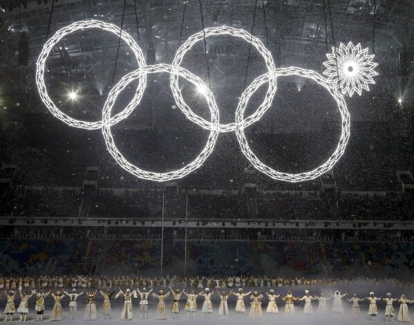 FILE - One of the rings forming the Olympic logo fails to open during the opening ceremony of the 2014 Winter Olympics in Sochi, Russia, Friday, Feb. 7, 2014. The glitch marred a majestic show of Russian history and culture during the opening ceremony. (AP Photo/Mark Humphrey, File)