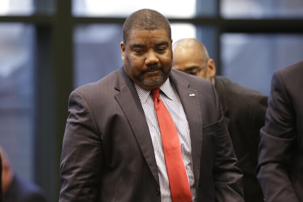 FILE - The Illinois Department of Children and Family Services Director Marc D. Smith arrives to testify before the House Appropriations-Human Services Committee, April 26, 2019, in Chicago. Smith said Wednesday, Oct. 4, 2023, that he will leave his post at the end of the year. (AP Photo/Kiichiro Sato, File)