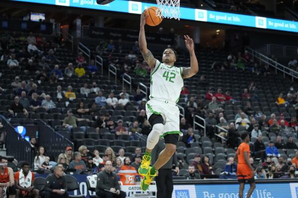 Oregon's Jacob Young (42) shoots against Oregon State during the first half of an NCAA college basketball game in the first round of the Pac-12 tournament Wednesday, March 9, 2022, in Las Vegas. (AP Photo/John Locher)
