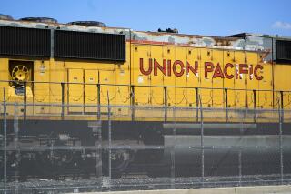 FILE - A Union Pacific train engine sits in a rail yard on Wednesday, Sept. 14, 2022, in Commerce, Calif. The railroad will release its third quarter earnings report Thursday afternoon. (AP Photo/Ashley Landis, File)