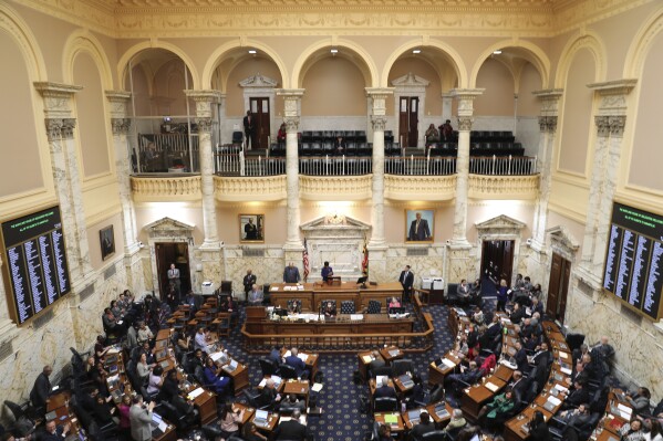 FILE - Maryland lawmakers in the House of Delegates work on Monday, March 18, 2024, in Annapolis, Md. Maryland lawmakers are convening for the last day of their legislative session. With a midnight Monday, April 8 deadline, lawmakers mostly will be putting finishing touches on priority legislation, such as a measure to help employees at the Port of Baltimore affected by the Francis Scott Key Bridge collapse. (AP Photo/Brian Witte, File)